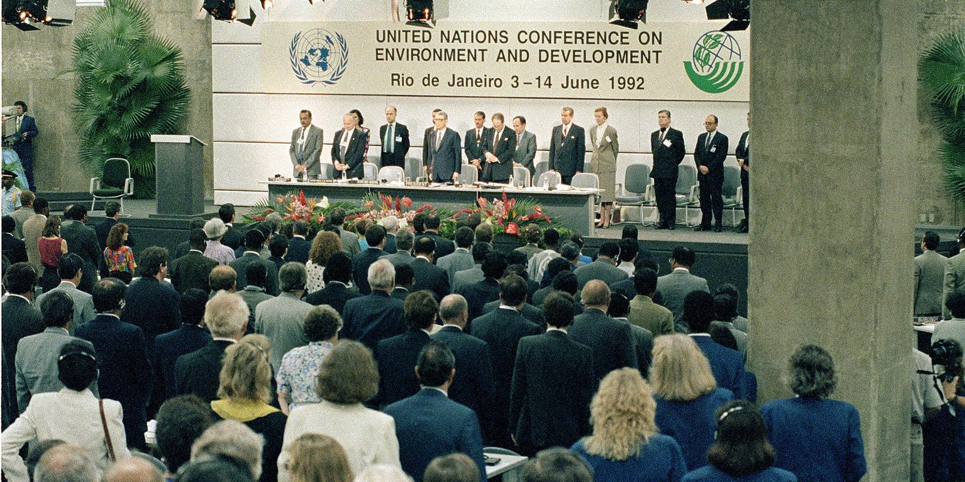 United Nations Secretary General Boutros Boutros-Ghali, center, and conference organizers are shown during opening ceremonies at the Earth Summit in Rio de Janeiro, Brazil, Thursday, June 3, 1992.  The 12-day summit, officially called the United Nations Conference on Environment and Development, is the largest gathering of heads of state, with more than 100 countries and delegations from 178 countries.  In addition, representatives of more than 1,000 non-governmental organizations (NGOs) will attend the meetings.  (AP Photo/Eduardo DiBaia)