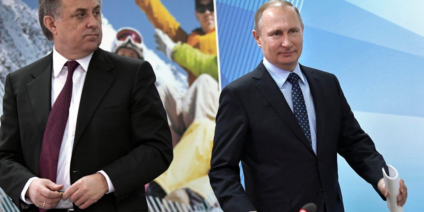Rysslands vice premiärminister Vitalij Mutko (till vänster) landets president Vladimir Putin (till höger). Arkivbild.
