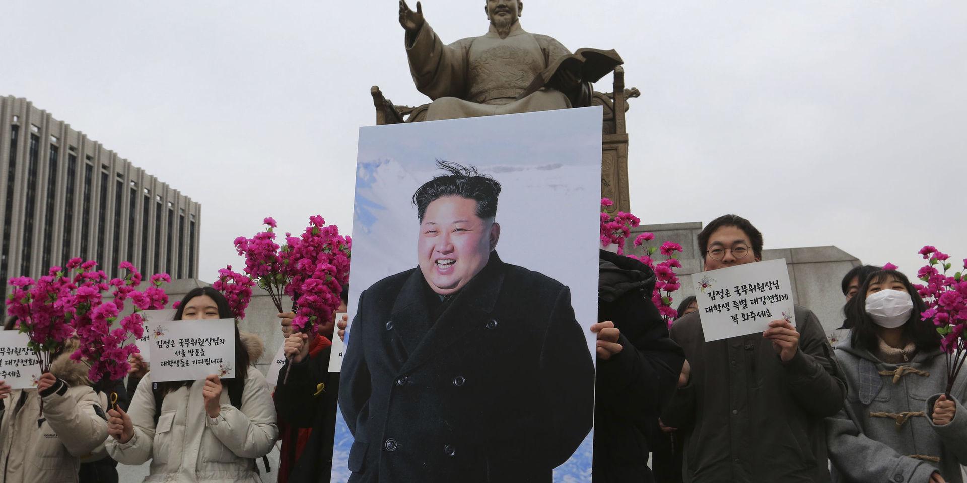 South Korean college students stand with a portrait of North Korean leader Kim Jong Un during a rally to welcome his possible visit to South Korea, in Seoul, South Korea, Thursday, Jan. 31, 2019. Secretary of State Mike Pompeo says he is sending a team &quot;someplace in Asia&quot; to set up a second summit between President Donald Trump and North Korean leader Kim Jong Un by the end of February. The signs read &quot; We welcome North Korean leader Kim Jong Un&apos;s visit.&quot; (AP Photo/Ahn Young-joon)