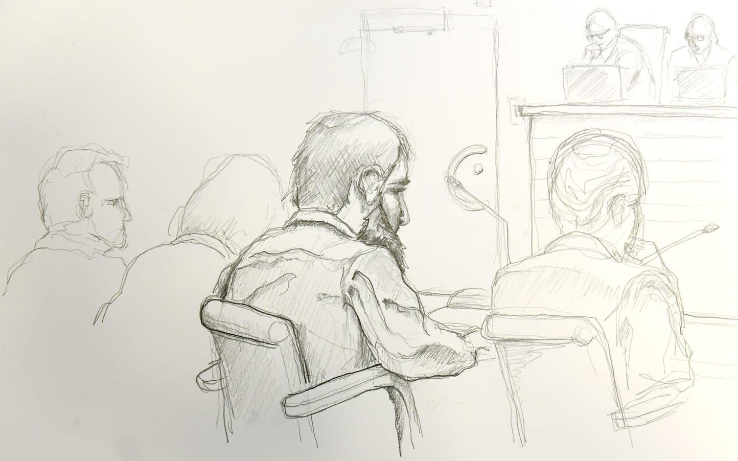 Terroråtalade Rakhmat Akilov illustrerad under rättegångens inledning.