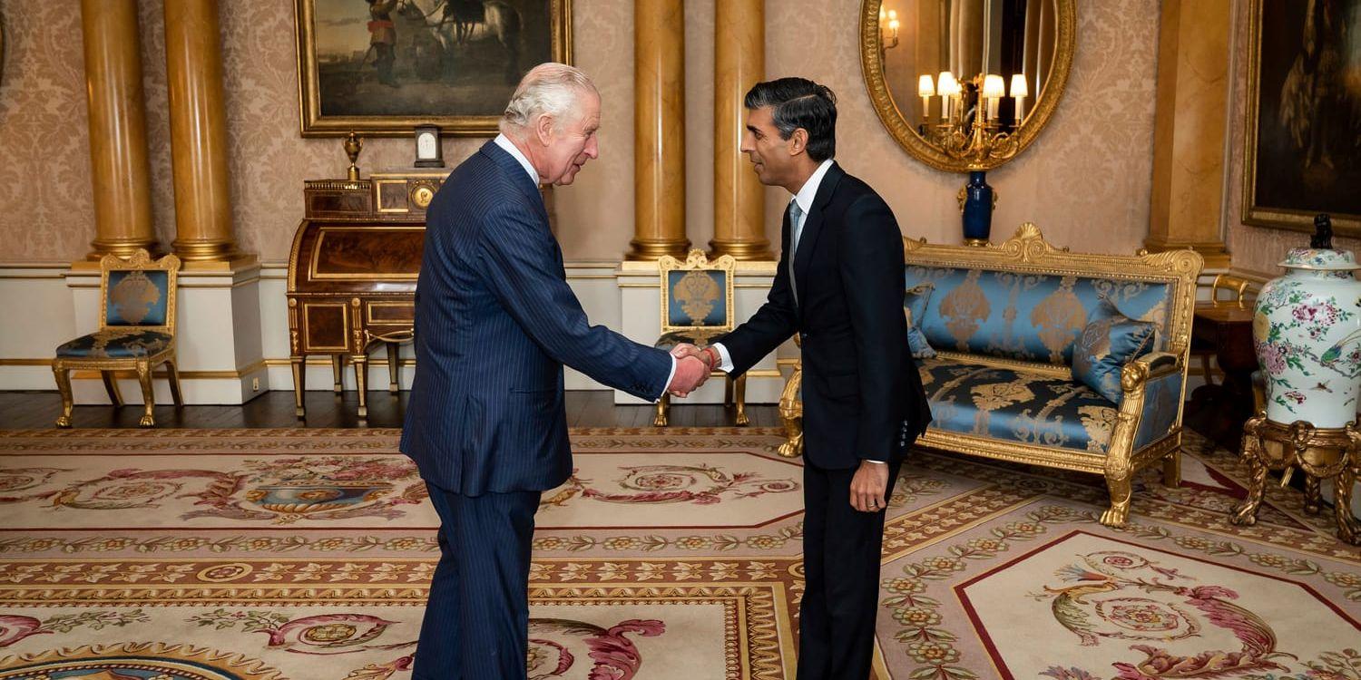 King Charles III welcomes Rishi Sunak during an audience at Buckingham Palace, London, where he invited the newly elected leader of the Conservative Party to become Prime Minister and form a new government, Tuesday, Oct. 25, 2022. (Aaron Chown/Pool photo via AP)  LON122