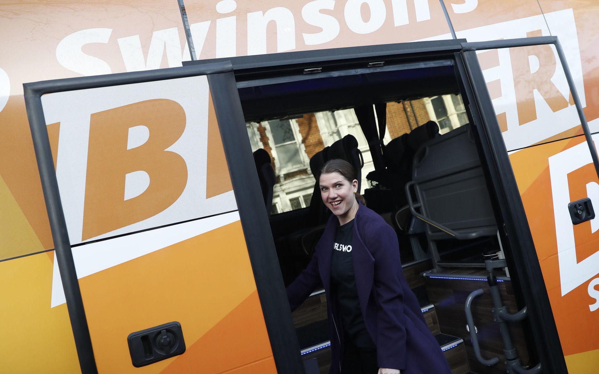 Liberal Democrats leader Jo Swinson boards her campaign bus after a  visit to the boxing gym Total Boxer, which offers training to young people as a means of keeping them away from violence during the General Election campaign trail, in London, Wednesday, Nov. 13, 2019. Britain goes to the polls on Dec. 12.  (AP Photo/Alastair Grant)  XAG109