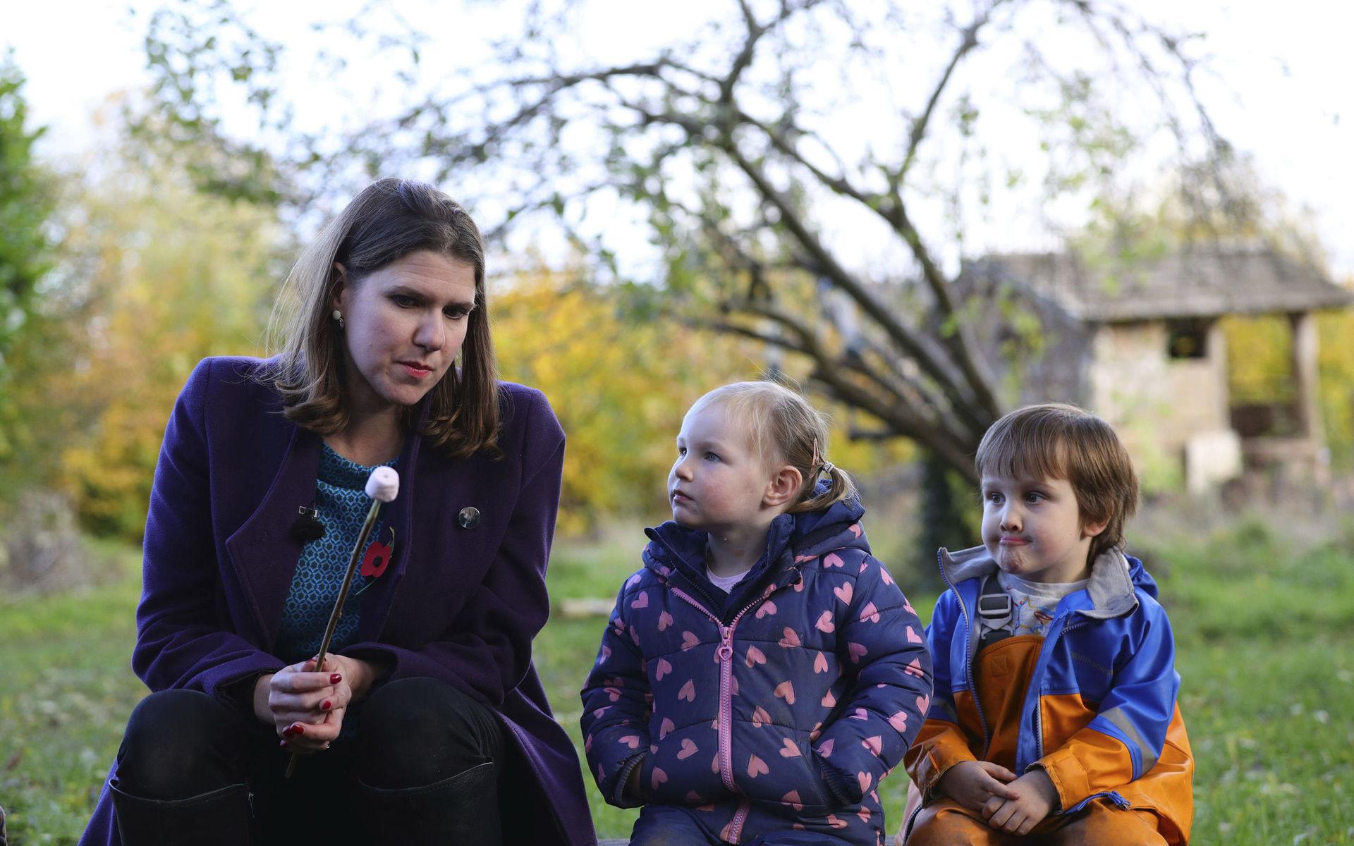 Britain&apos;s Liberal Democrats leader Jo Swinson prepares to eat a marshmallow as she sits with children at Free Rangers Nursery in Midsomer Norton for an engagement as part of the General Election campaign trail, in Somerset, England, Thursday, Nov. 7, 2019. Britain goes to the polls on Dec. 12.  (Aaron Chown/PA via AP)  TH805