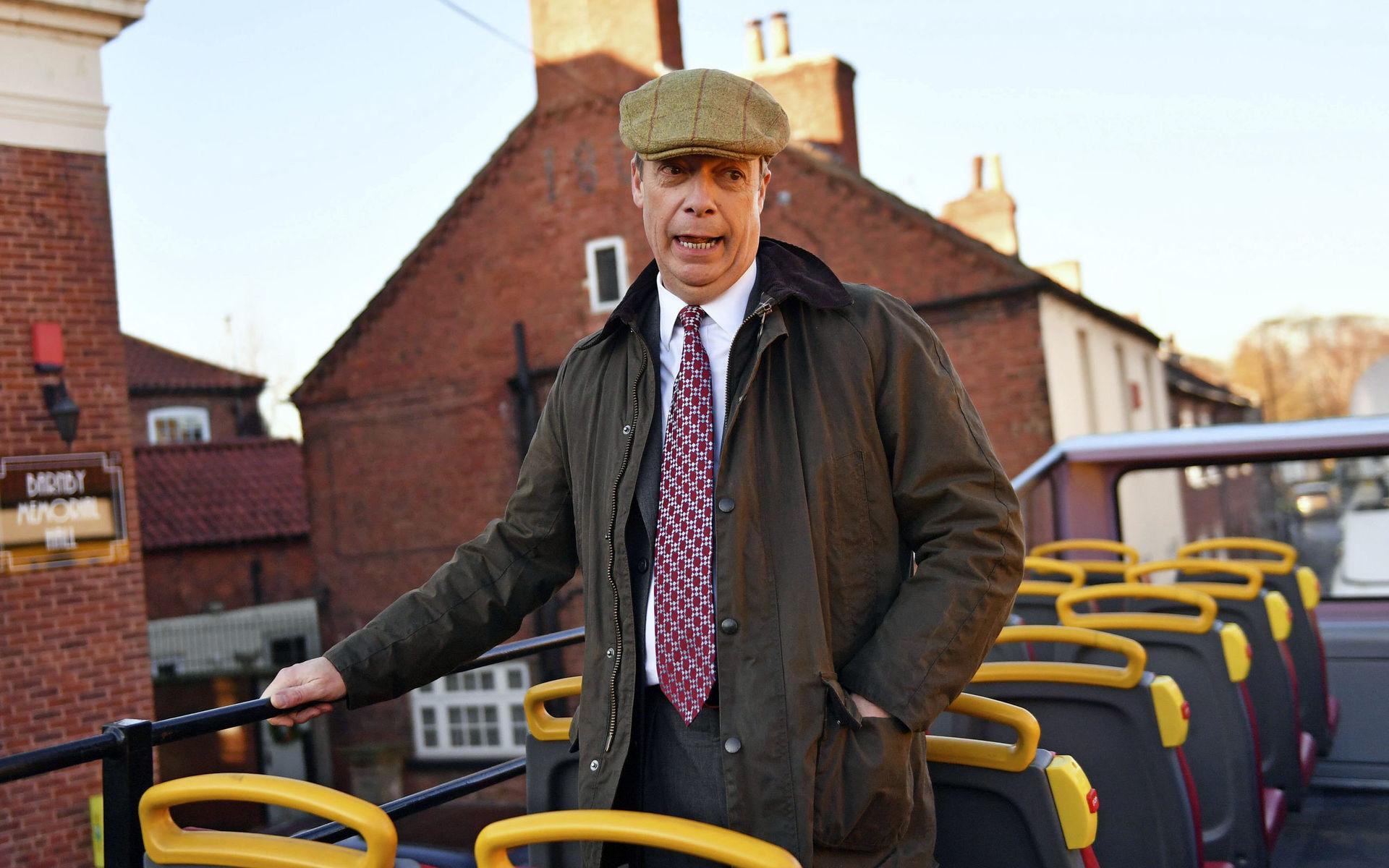 Brexit Party leader Nigel Farage on the party&apos;s campaign bus whilst on the General Election campaign trail in Worksop, England, Tuesday, Dec. 3, 2019. (Jacob King/PA via AP)  LLT801