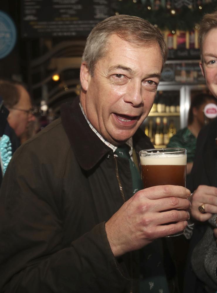 Brexit Party leader Nigel Farage has a pint of beer at a pub in Barnsley, England, while on the General Election campaign trail, Tuesday Nov. 26, 2019.  Britain&apos;s Brexit is one of the main issues for political parties and for voters, as the UK prepares to go to the polls in a General Election on Dec. 12. (Danny Lawson/PA via AP)  WRC833