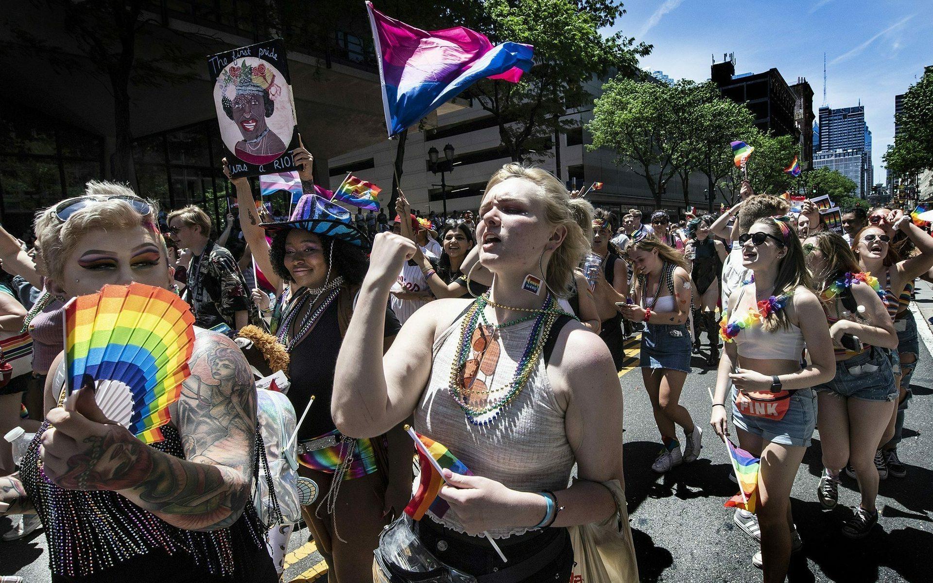 Parade-goers dance in the street during Philly&apos;s LGBT Pride Parade in Philadelphia on Sunday, June 9, 2019. The parade theme was Stonewall 50, in honor of the 50th anniversary of the Stonewall riots and the beginning of the LGBT rights movement. (Jose F. Moreno/The Philadelphia Inquirer via AP)