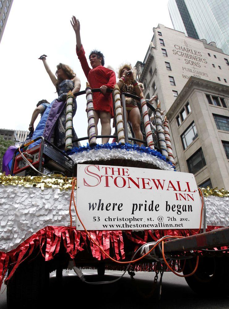 Drag queens wave from a float that honors  the 40th anniversary of the Stonewall Riots during New York&apos;s annual Gay Pride Parade, Sunday, June 28, 2009 in New York.  Marchers marked the 40th anniversary of the Stonewall uprisings, a raid on the gay-friendly Stonewall Inn that was the starting point for riots that lasted several days in Manhattan&apos;s Greenwich Village. The event became a defining moment for the gay rights movement.(AP Photo/Seth Wenig)