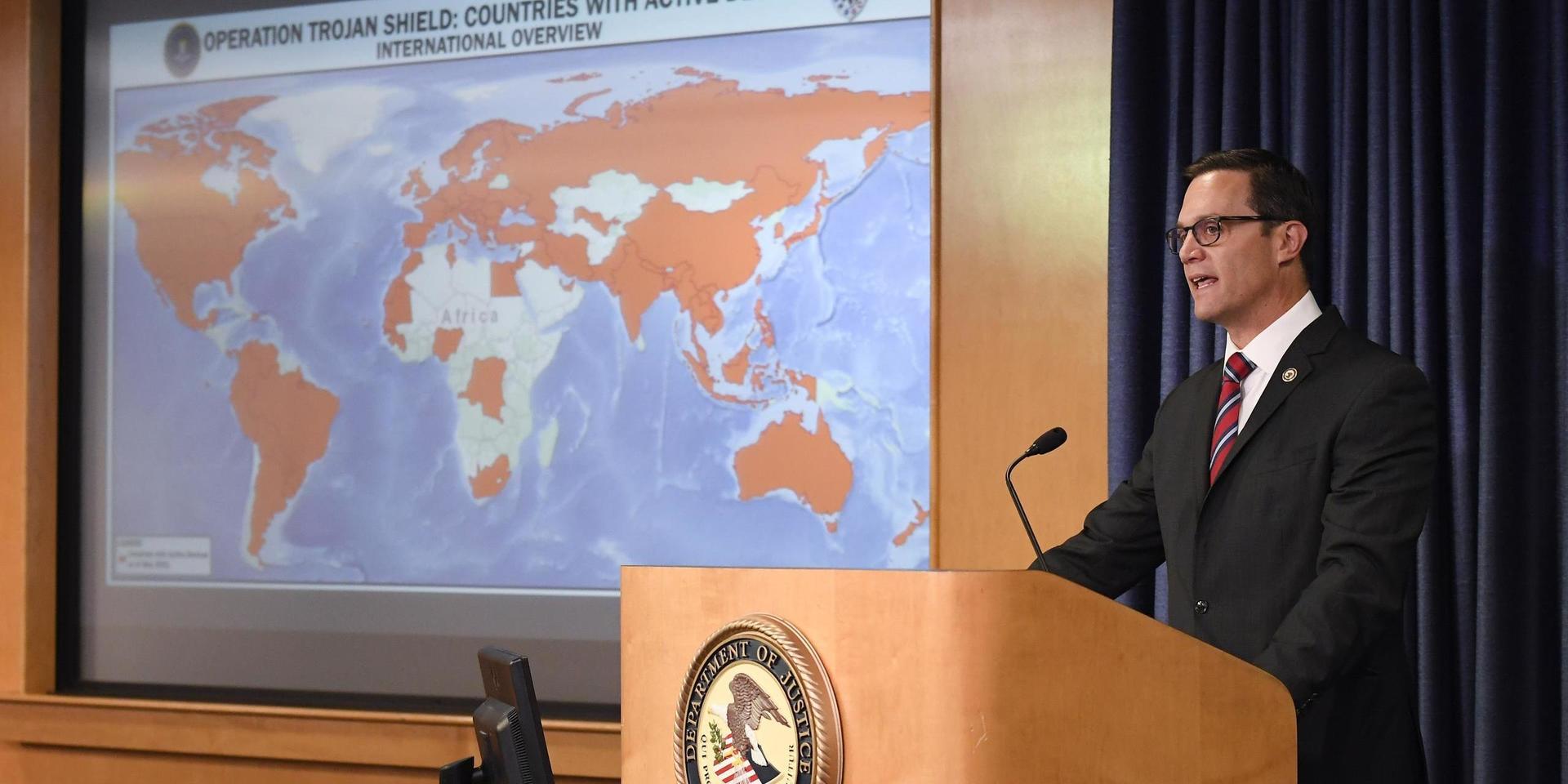 Acting U.S. Attorney Randy Grossman speaks at a news conference announcing Operation Trojan shield, Tuesday, June 8, 2021, in San Diego. The global sting operation involved an encrypted communications platform developed by the FBI and sparked a series of raids and arrests around the world in which more than 800 suspects were arrested and more than 32 tons of drugs — cocaine, cannabis, amphetamines and methamphetamines were seized. (AP Photo/Denis Poroy)  CADP104
