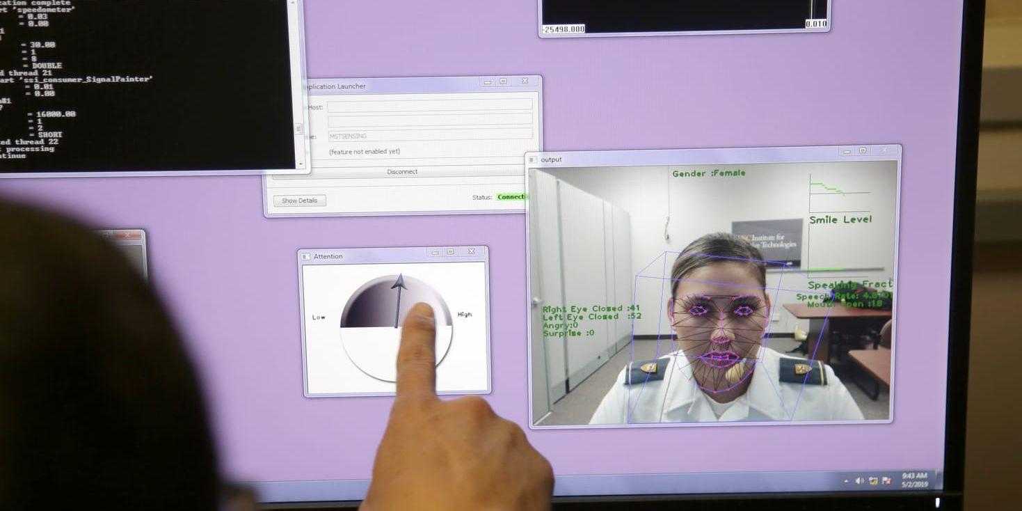 In this file photo from May 2, 2019, a computer monitors some of Cadet Cheyenne Quilter's reactions as she works with a virtual reality character named "Ellie" at the U.S. Military Academy at West Point, N.Y. Artificial intelligence is spreading into health care, often as software or a computer program capable of learning from large amounts of data and making predictions to guide care or help patients. (AP Photo/Seth Wenig, File)  NYSW209
