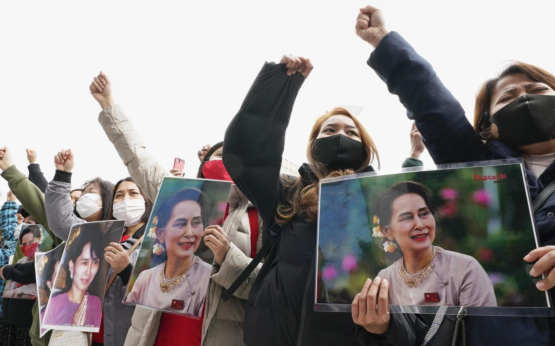 People holding portraits of Myanmar&apos;s de facto government leader Aung San Suu Kyi stage a protest rally in front of the United Nations University in Tokyo Monday, Feb. 1, 2021, after Myanmar&apos;s military was taking control of the country for one year. (Chika Oshima/Kyodo News via AP)  TKTT802