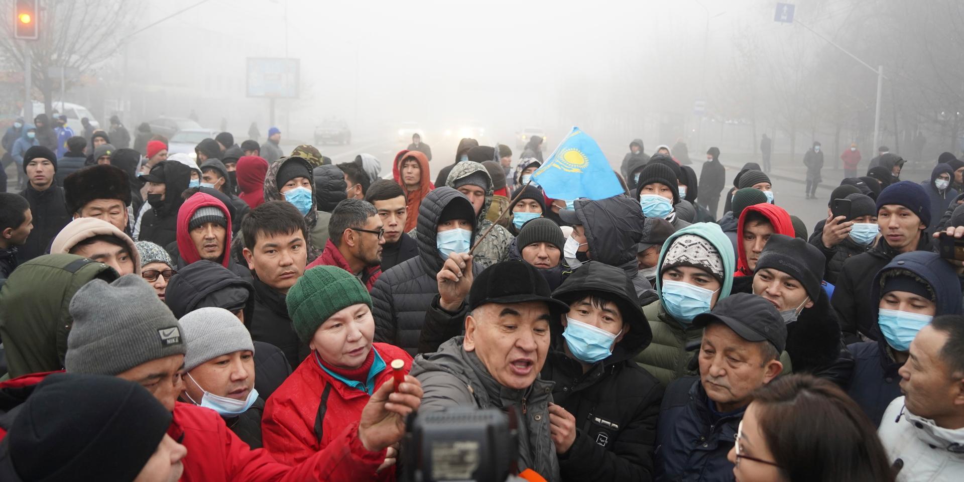  Demonstrators, one of which holds a police ammunition, gather during a protest in Almaty, Kazakhstan, Wednesday, Jan. 5, 2022. Demonstrators denouncing the doubling of prices for liquefied gas have clashed with police in Kazakhstan's largest city and held protests in about a dozen other cities in the country. (AP Photo/Vladimir Tretyakov)  XAZ123