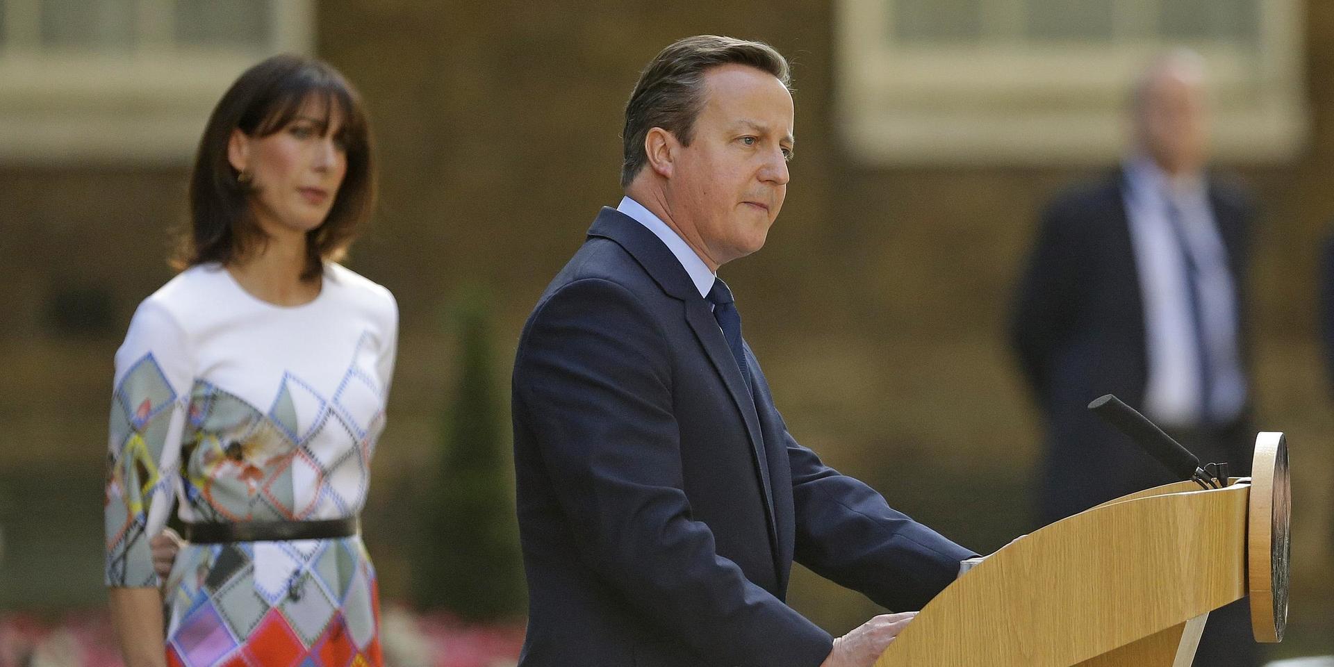 A  Friday, June 24, 2016 file photo of Britain&apos;s Prime Minister, David Cameron, speaking outside 10 Downing Street, London as his wife Samantha looks on. 
