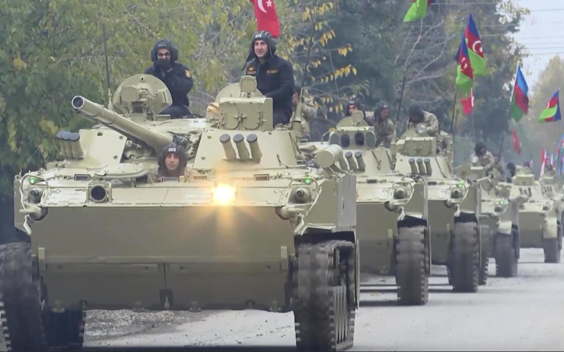 In this image from video, Azerbaijani forces move towards Aghdam in the Aghdam region Friday, Nov. 20, 2020. Units of the Azerbaijani army on Friday morning entered the Aghdam region, a territory ceded by Armenian forces in a cease-fire agreement that ended six weeks of heavy fighting over the separatist region of Nagorno-Karabakh, Azerbaijan&apos;s Defense Ministry said. (AP Photo)  XEL104