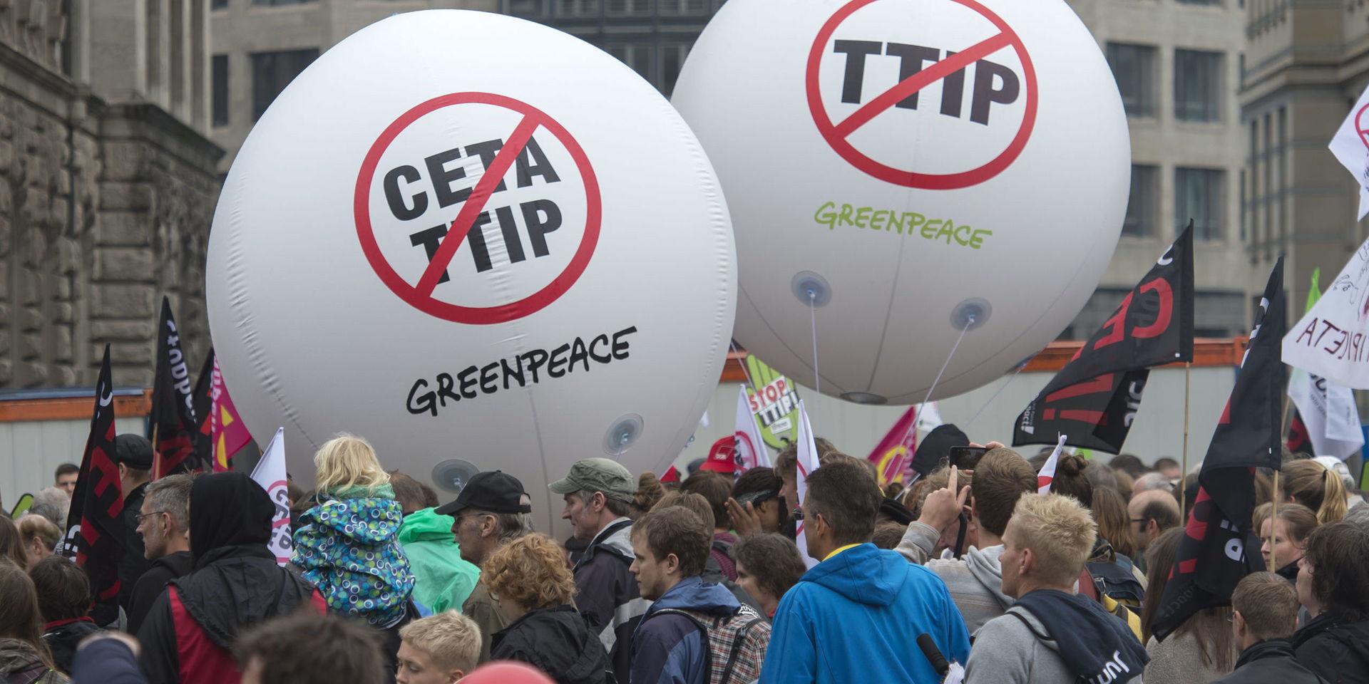 People demonstrate against the TTIP and CETA trade agreements in Leipzig, Germany, Saturday, Sept. 17, 2016. Thousands of people are rallying in cities across Germany to protest against planned European Union trade deals with the United States and Canada.