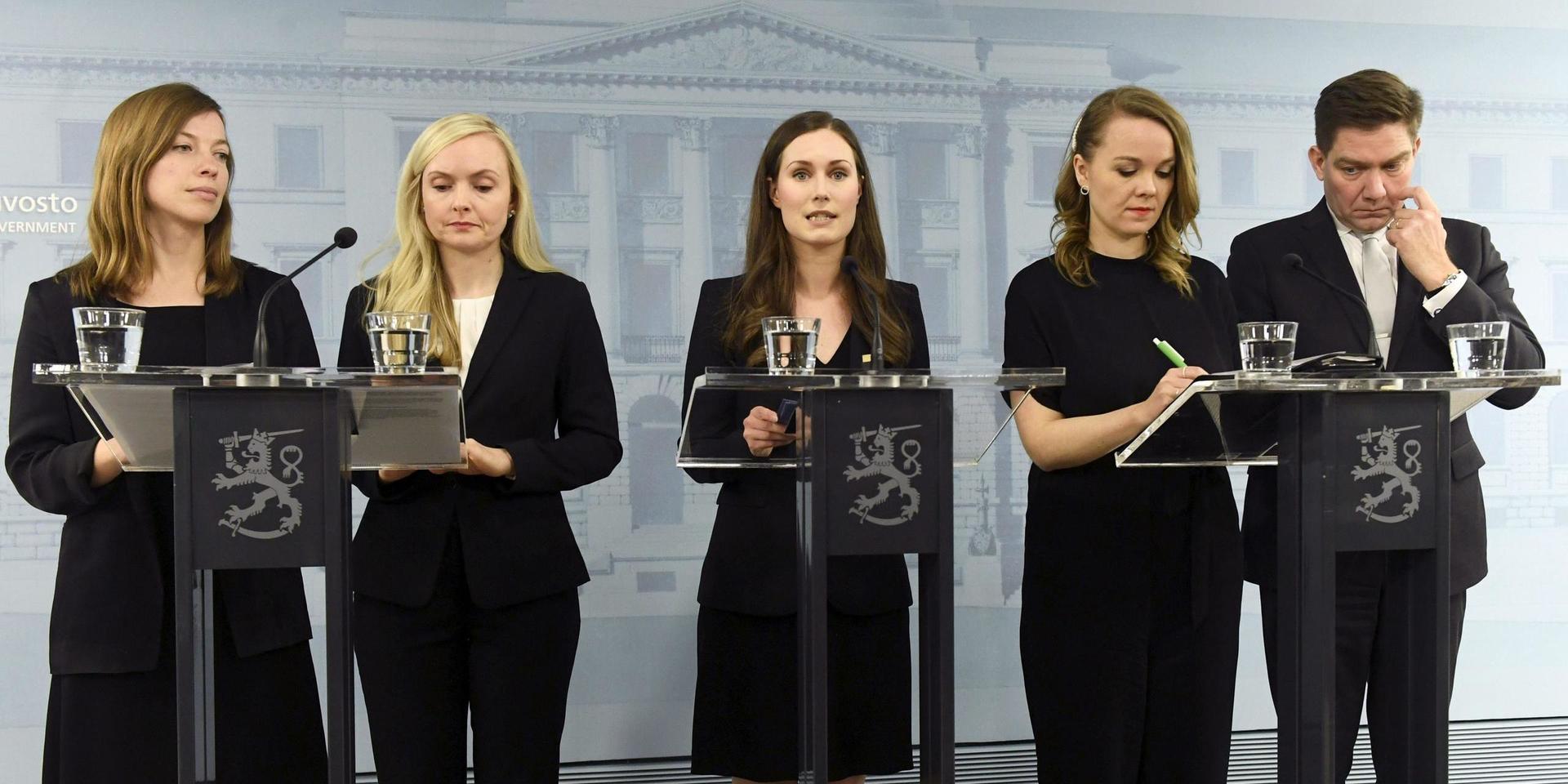 From left, Minister of Education Li Andersson, Minister of Interior Maria Ohisalo, Prime Minister Sanna Marin, Minister of Finance Katri Kulmuni and Minister for Nordic Cooperation and Equality Thomas Blomqvist during a press conference of the new Finnish government in Helsinki, Finland, on Tuesday, Dec. 10, 2019. Finland’s parliament chose Sanna Marin as the country's new prime minister Tuesday, making the 34-year-old the world’s youngest sitting head of government. (Vesa Moilanen/Lehtikuva via AP)  WRC832