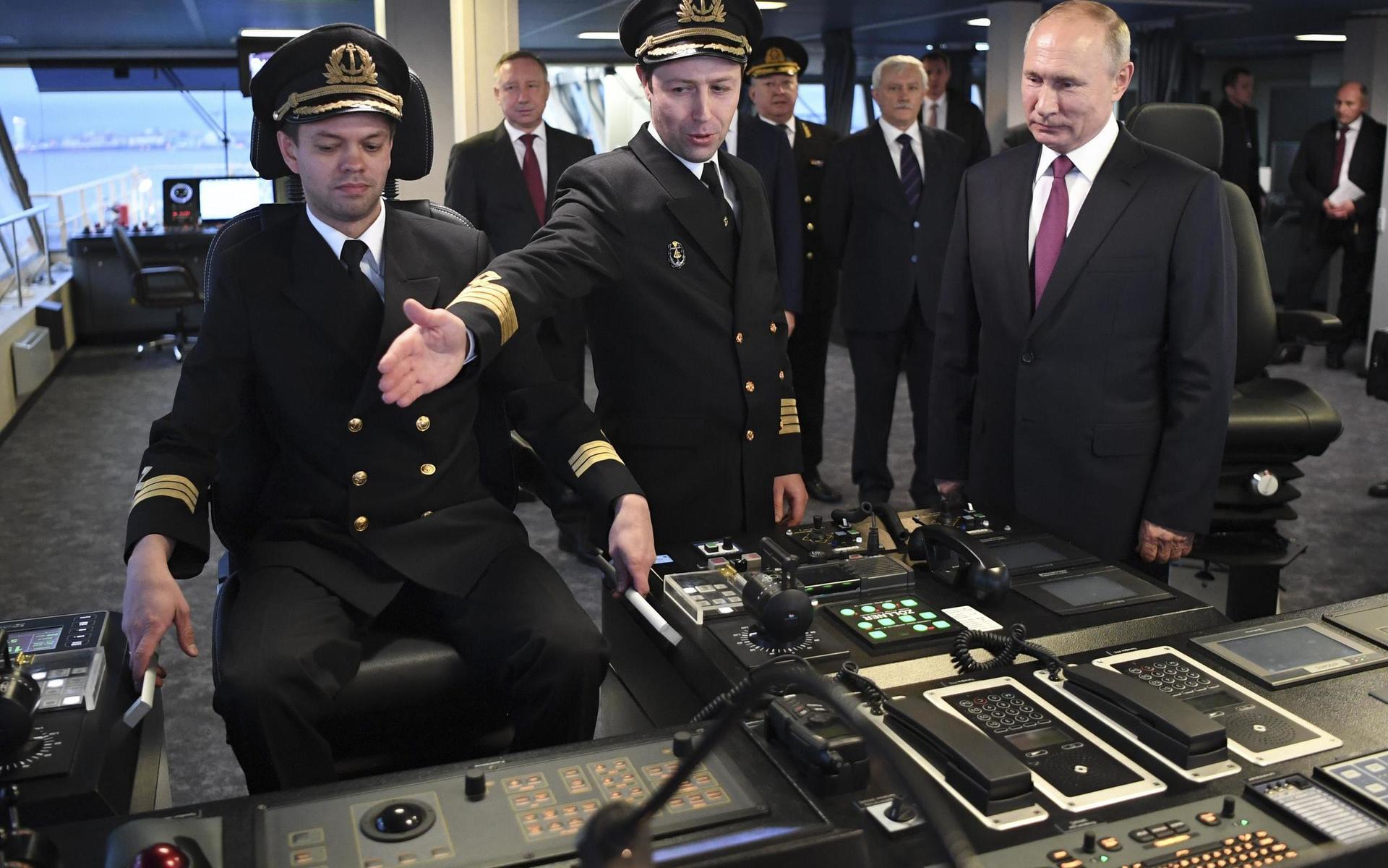 Russian President Vladimir Putin, right, visits the captain&apos;s bridge of the newly built diesel-electric icebreaker &quot;Viktor Chernomyrdin&quot; in St. Petersburg, Russia, Tuesday, Nov. 3, 2020. Putin said that Russia will expand its fleet of icebreakers as part of its efforts to develop the Arctic territories. (Alexei Nikolsky, Sputnik, Kremlin Pool Photo via AP)  XAZ103