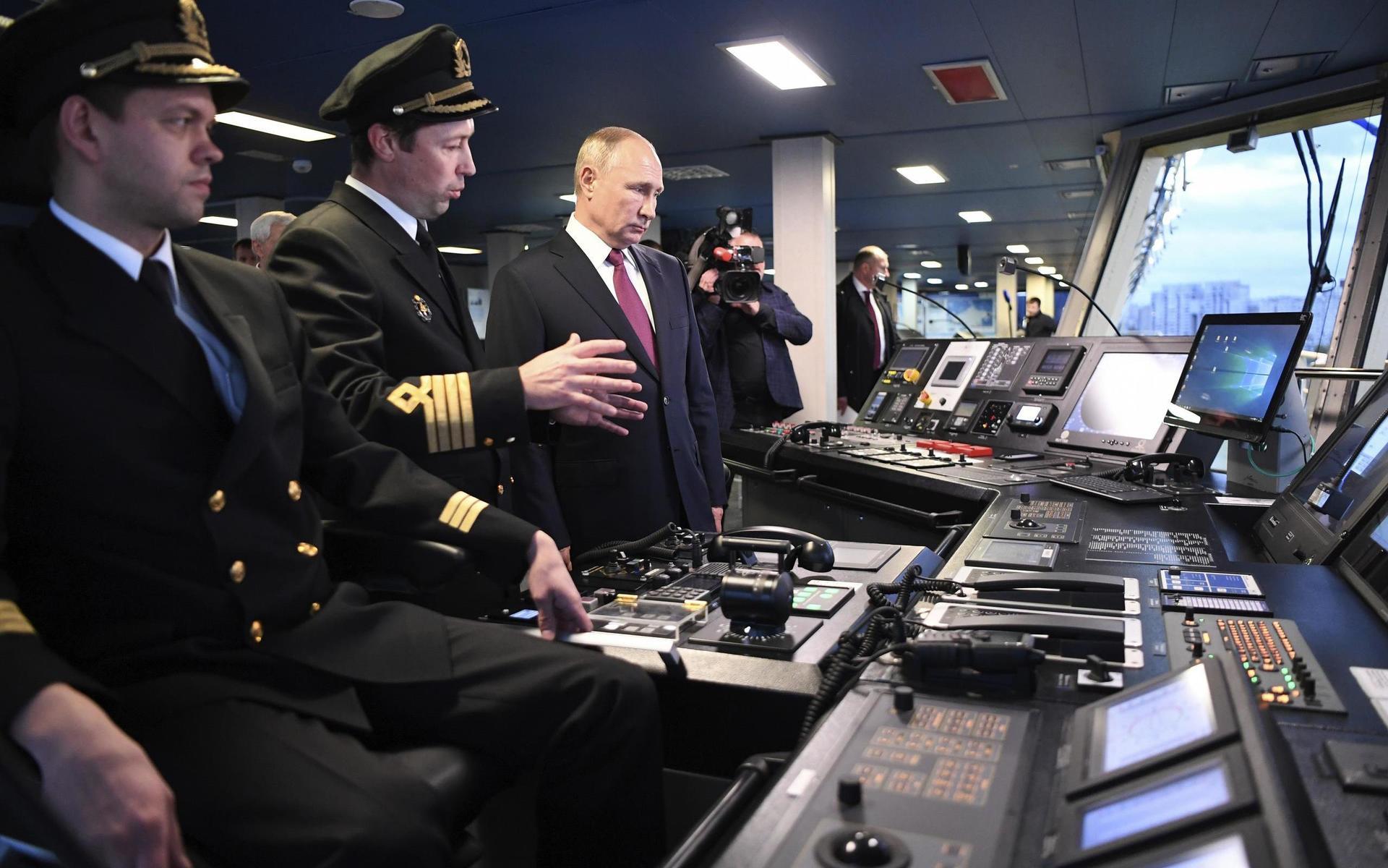 Russian President Vladimir Putin, center, visits the captain&apos;s bridge of the newly built diesel-electric icebreaker &quot;Viktor Chernomyrdin&quot; in St. Petersburg, Russia, Tuesday, Nov. 3, 2020. Putin said that Russia will expand its fleet of icebreakers as part of its efforts to develop the Arctic territories. (Alexei Nikolsky, Sputnik, Kremlin Pool Photo via AP)  XAZ101