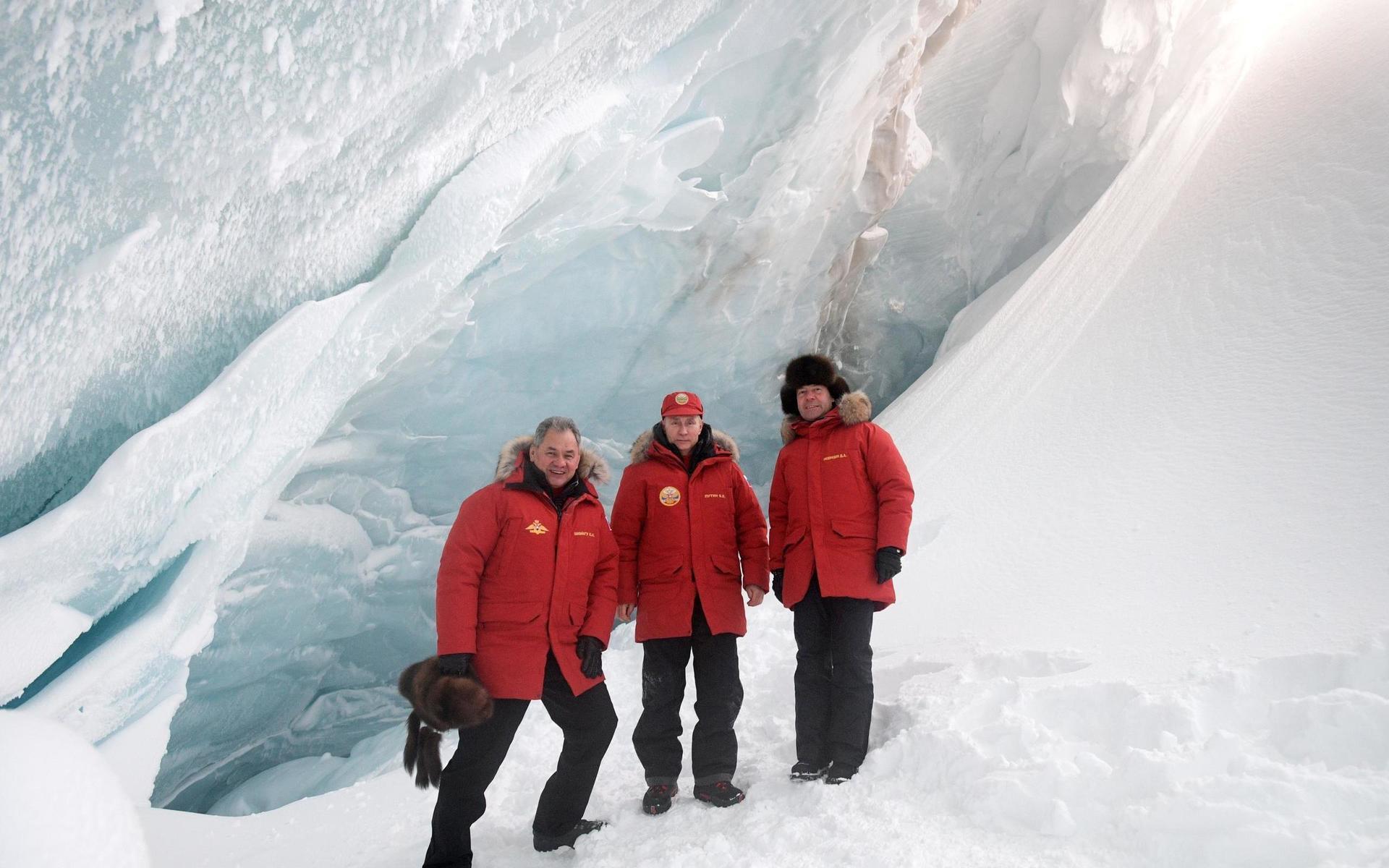 Russian President Vladimir Putin, center, Prime Minister Dmitry Medvedev, right, and Defense Minister Sergei Shoigu, pose for a photo as they inspect a cavity in a glacier on the Arctic Franz Josef Land archipelago in Arctic Russia, Wednesday, March 29, 2017. Russia has sought to strengthen its foothold in the Arctic amid intensifying rivalry for the region&apos;s rich natural resources between polar countries.(Alexei Druzhinin, Sputnik, Kremlin Pool Photo via AP)