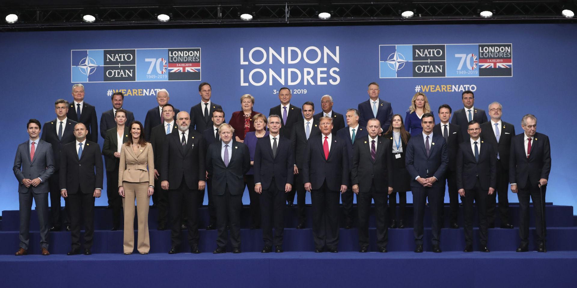 NATO heads of state and government pose for a group photo during a NATO leaders meeting at The Grove hotel and resort in Watford, Hertfordshire, England, Wednesday, Dec. 4, 2019. NATO Secretary-General Jens Stoltenberg rejected Wednesday French criticism that the military alliance is suffering from brain death, and insisted that the organization is adapting to modern challenges. (AP Photo/Francisco Seco)  VLM126
