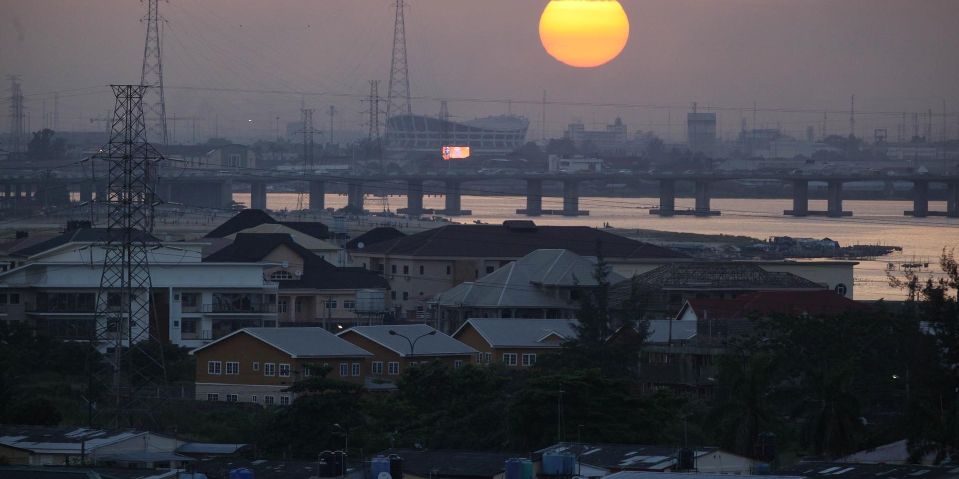 The sun sets over the National Theatre in Lagos, Nigeria, on Saturday, June 15, 2013. (AP Photo/Jon Gambrell)